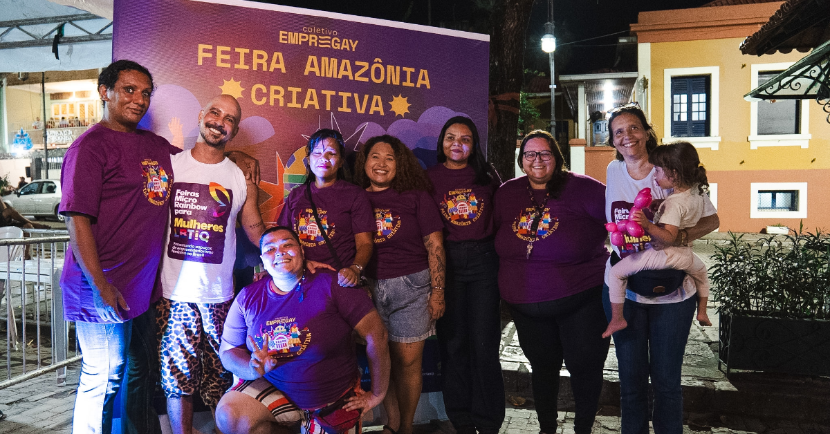 A group of people stood in front of a banner for Amazônia Criativa