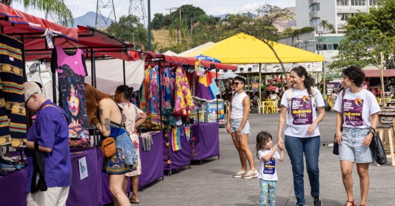 People stood in front of a stall at a fair